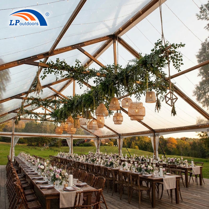 Faux timber aluminum frame tent setup for outdoor rustic wedding
