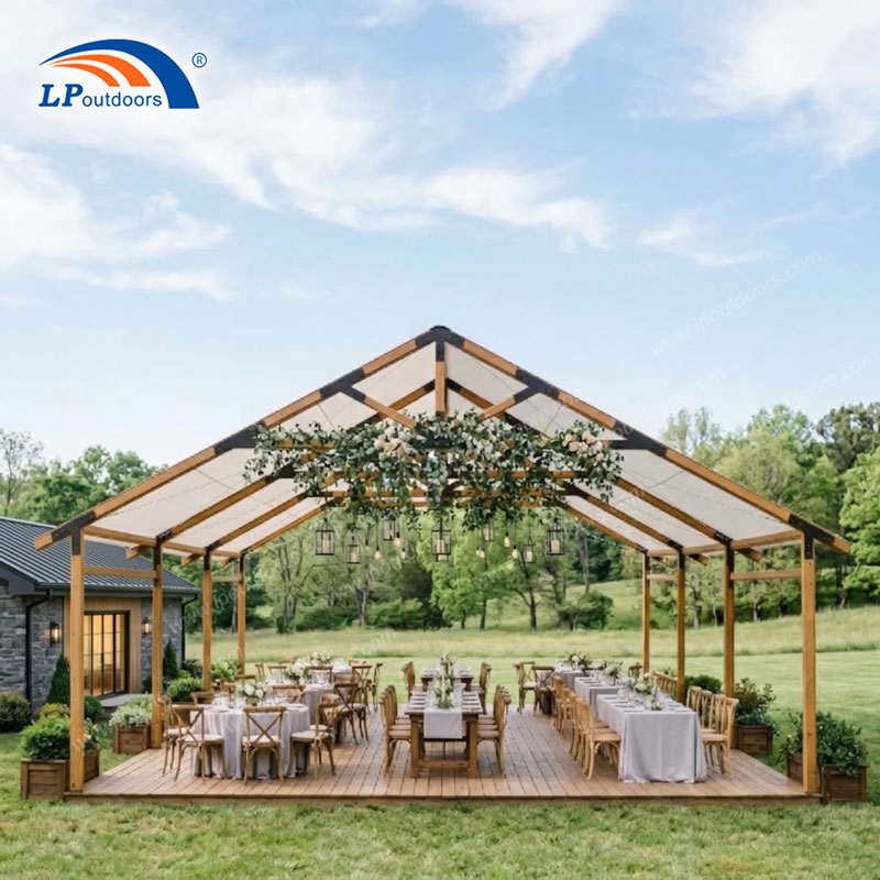 Faux timber aluminum frame tent setup for outdoor rustic wedding