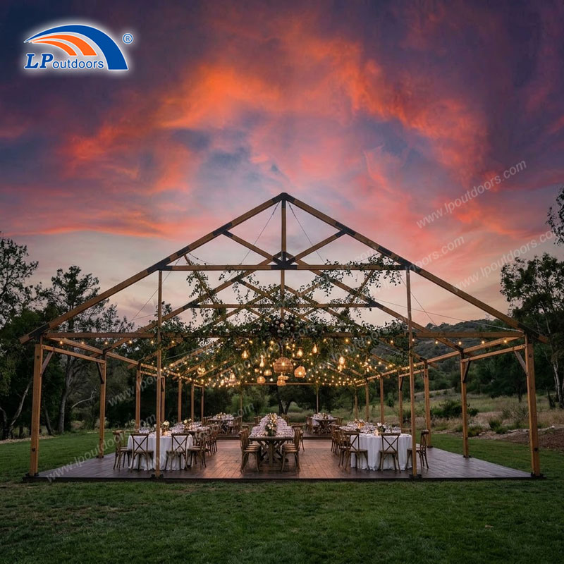 Faux timber aluminum frame tent setup for outdoor rustic wedding